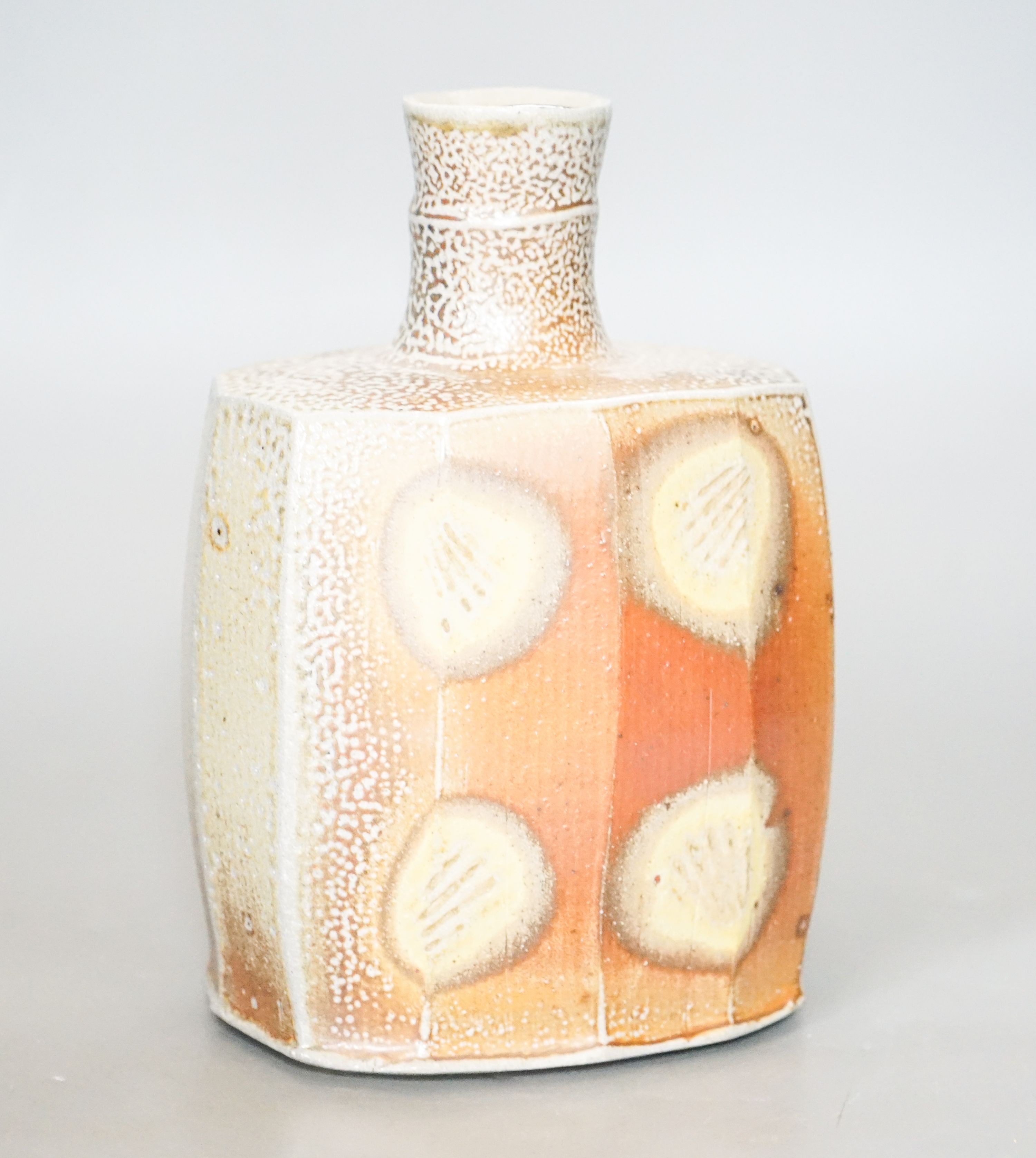 Phil Rogers (1951-2020), a faceted bottle 21cm